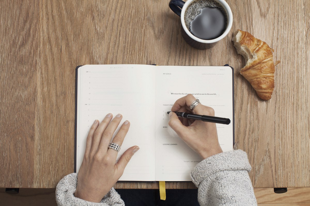Open journal with notes used during a planning review