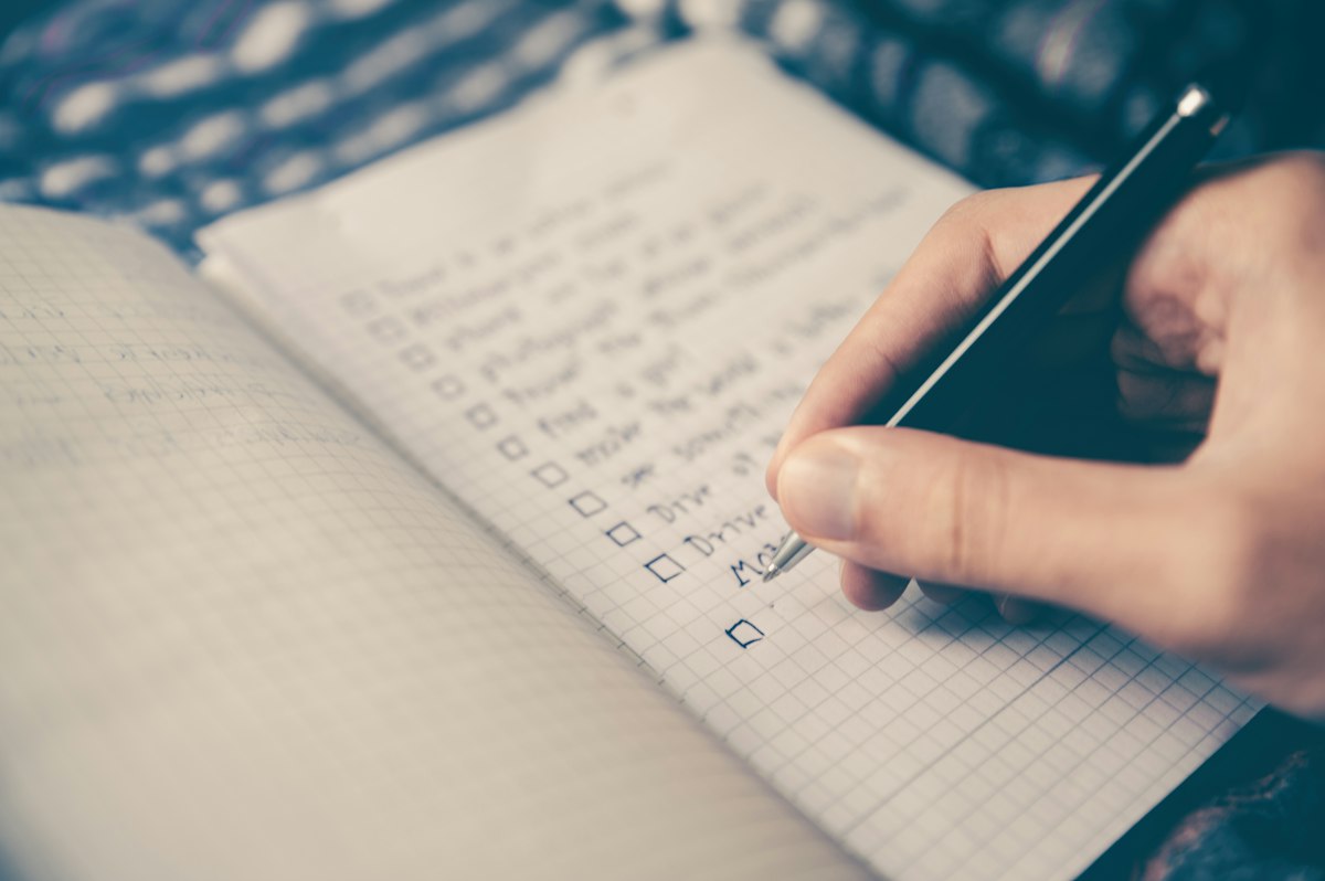 Notebook and pen on a desk used for annual planning notes